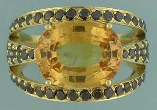 HONEY/GOLD SAPPHIRE OVAL6.11 CTS..mounted in 18k ring  