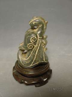   an exquisite chinese celadonish jade statue brightly and vividly