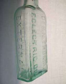 Small green glass bottle   Dr. S. N. Thomas Eclectric Oil.