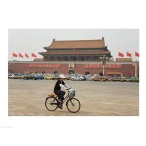  Tourist riding a bicycle at a town square, Tiananmen Gate 