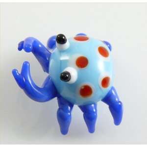 Brightly colored Crab, Light Blue body with red dots & Dark Blue legs 
