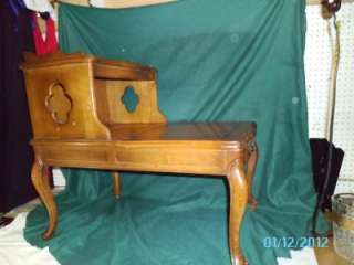   LEATHER TOP STEP END TABLE WITH CABRIOLE LEGS AND CURVED OUT SIDES