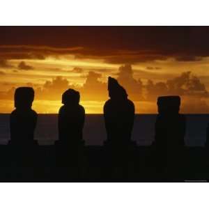  Ancient Statues Are Silhouetted Against a Sunset Sky, Ahu Vai 