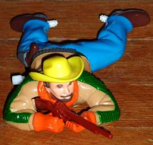 The following listing is of an Old Cowboy Crawler Mechanical Toy That 