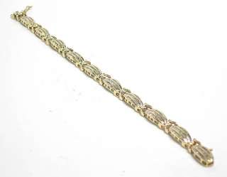   is a beautiful vintage 10k solid gold and diamond bracelet each link